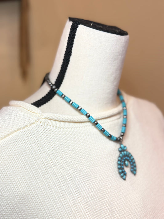Turquoise squash blossom